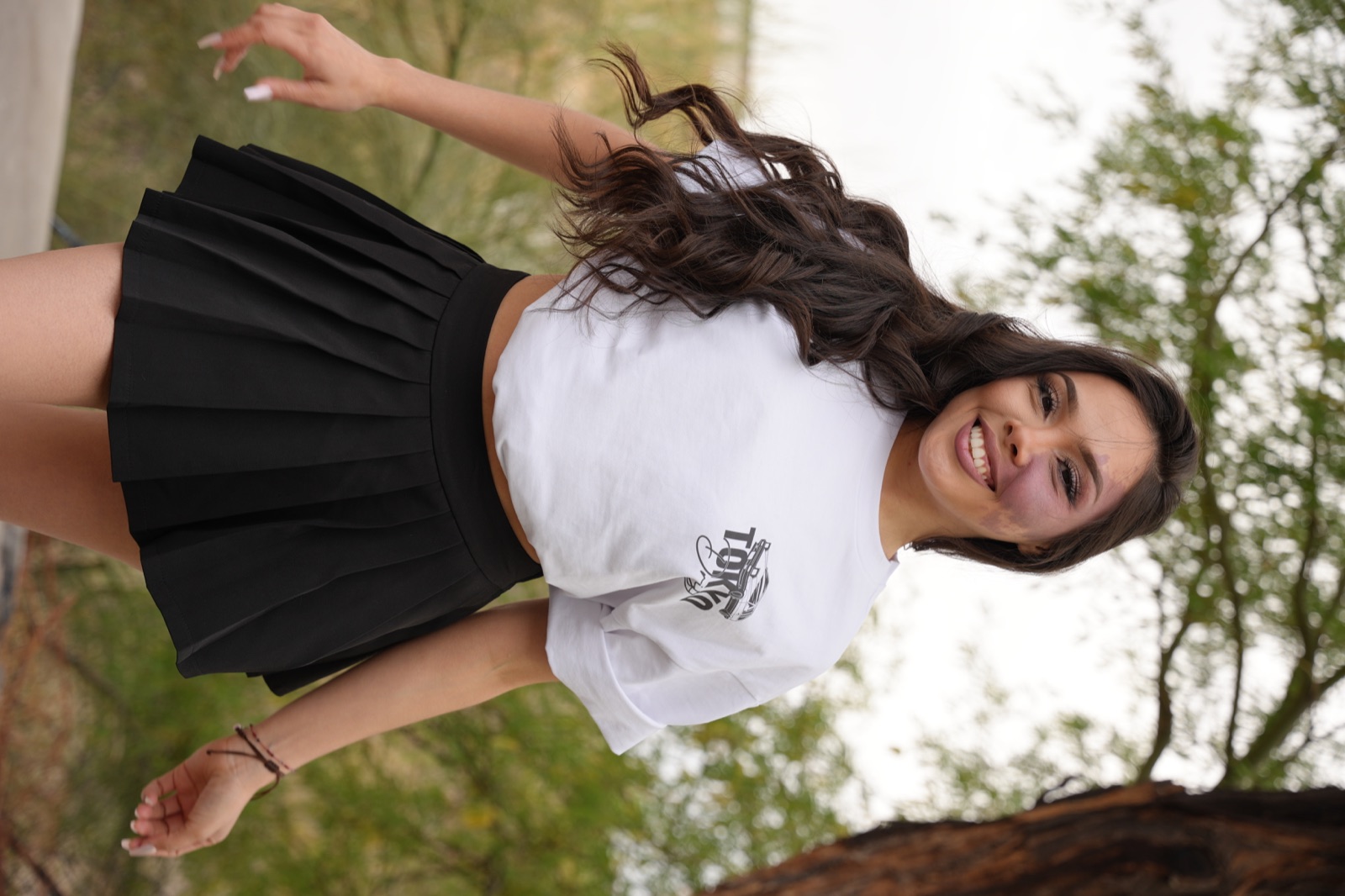 Yoselin smiling outdoors